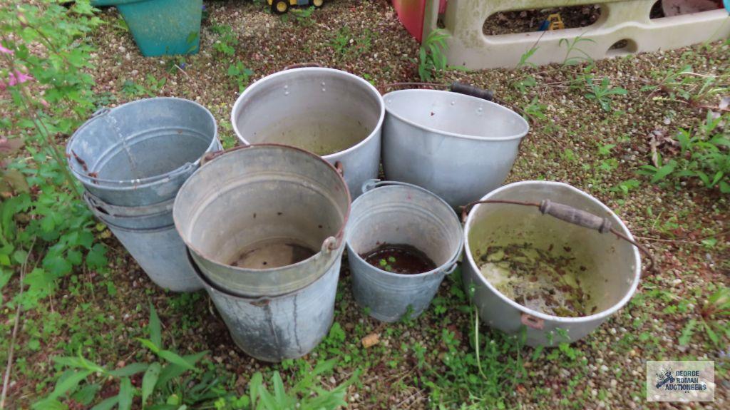 Lot of aluminum pots and metal buckets