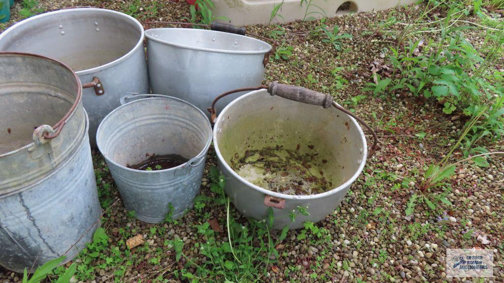 Lot of aluminum pots and metal buckets