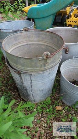 Lot of aluminum pots and metal buckets