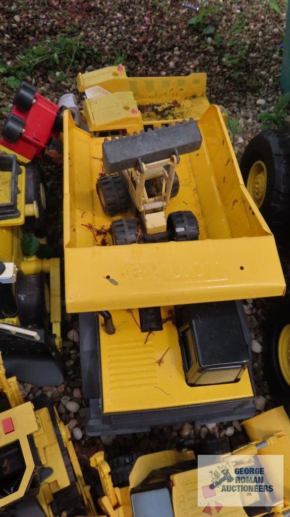 Lot of Tonka trucks and other toys