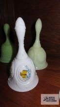 White butterfly hand-painted bell. green bell, no clapper. both marked Fenton.