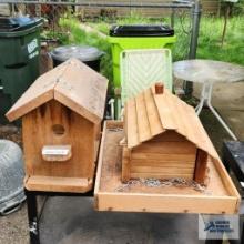 Two wooden bird feeders