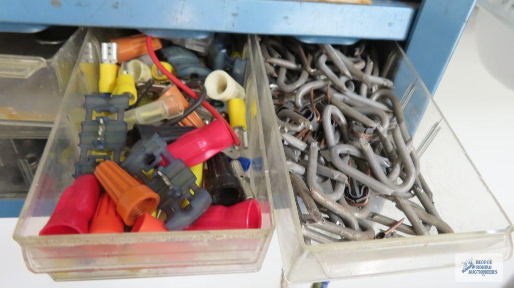 Assorted hardware on blue wall shelf, shelf is included