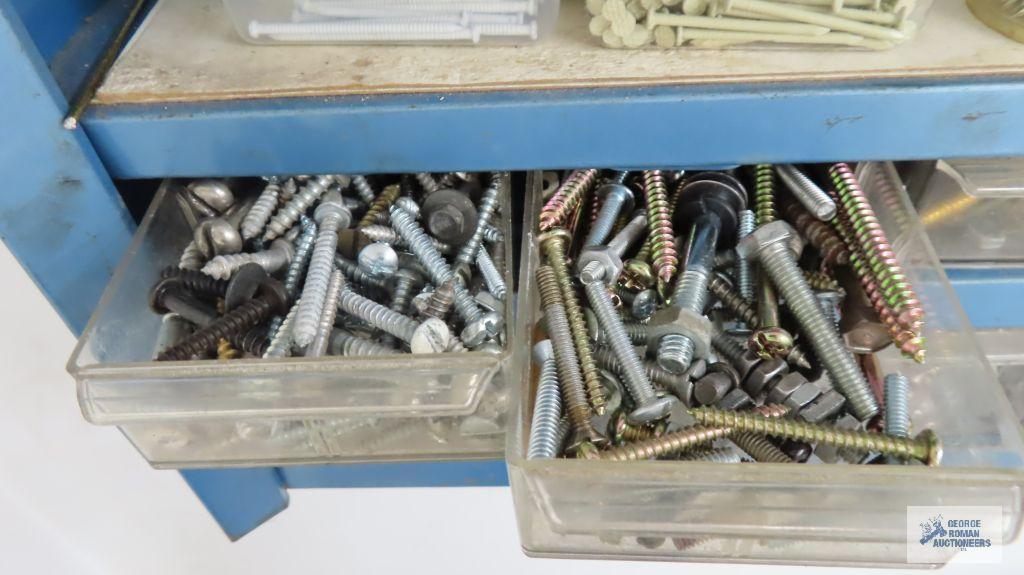 Assorted hardware on blue wall shelf, shelf is included