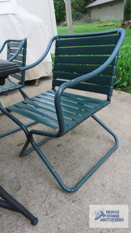 Outdoor patio...set with umbrella and five chairs