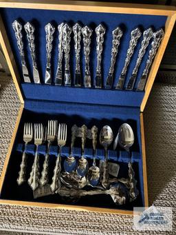 Service for 12 flatware by Oneida, Stainless. Includes serving pieces.