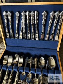 Service for 12 flatware by Oneida, Stainless. Includes serving pieces.