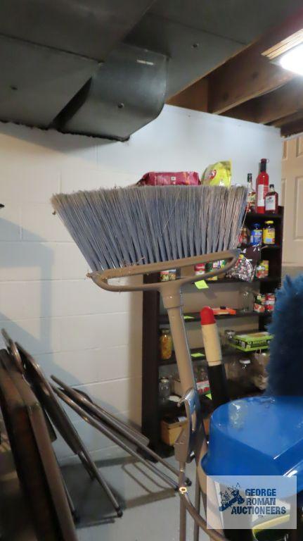Container of mops and brooms