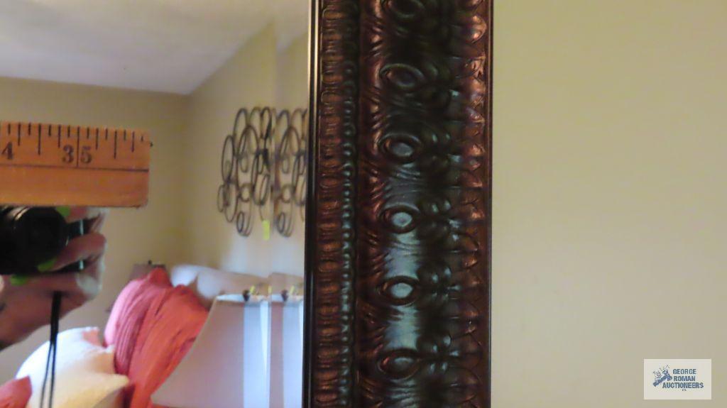 Decorative metal trimmed beveled mirror
