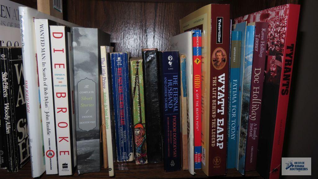 Two shelves of books dealing with history and biographies