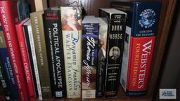 Two shelves of books dealing with history and biographies