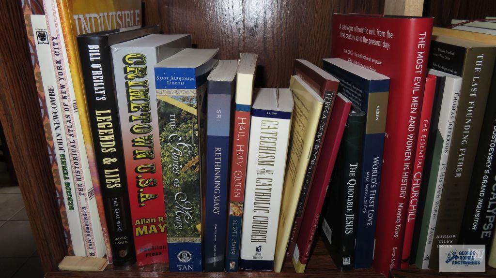 Two shelves of books dealing with history and biographies