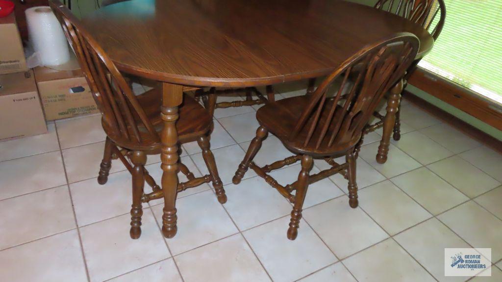 Table with two leaves and four chairs