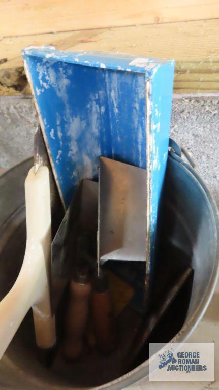 Galvanized bucket with drywall tools