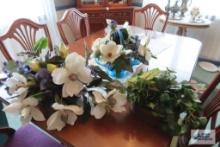 Two brass planters and one aqua glass basket, including florals and greenery