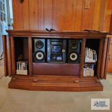 Sony stereo with cabinet, CDs and VHS tapes