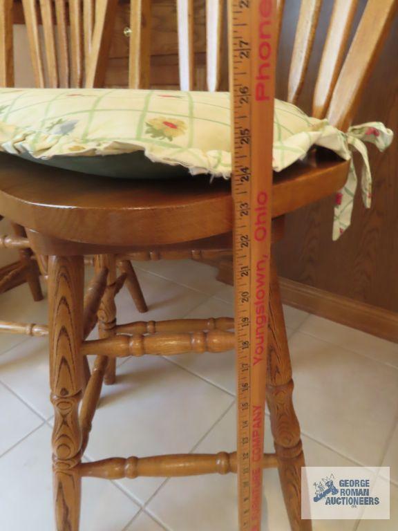 Two oak bar swivel stools. made in China