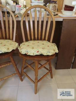 Two oak bar swivel stools. made in China