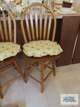 Two oak bar swivel stools. made in China