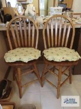 Two oak bar swivel stools. made in China