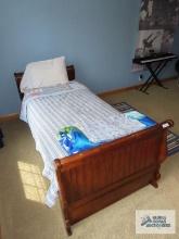 Twin size wood bed with trundle. on second floor