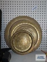 Three assorted brass wall plaques