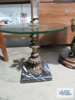 Decorative glass top accent table with heavy marble base. glass has chips.
