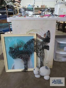 Variety of cat wall hangings and cat figurine