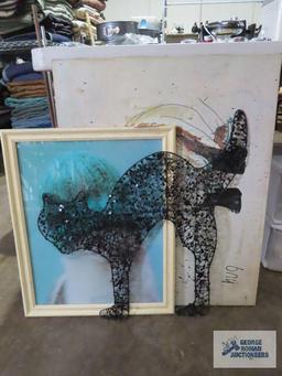 Variety of cat wall hangings and cat figurine