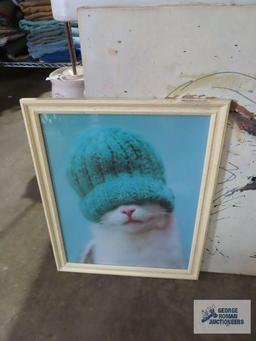 Variety of cat wall hangings and cat figurine