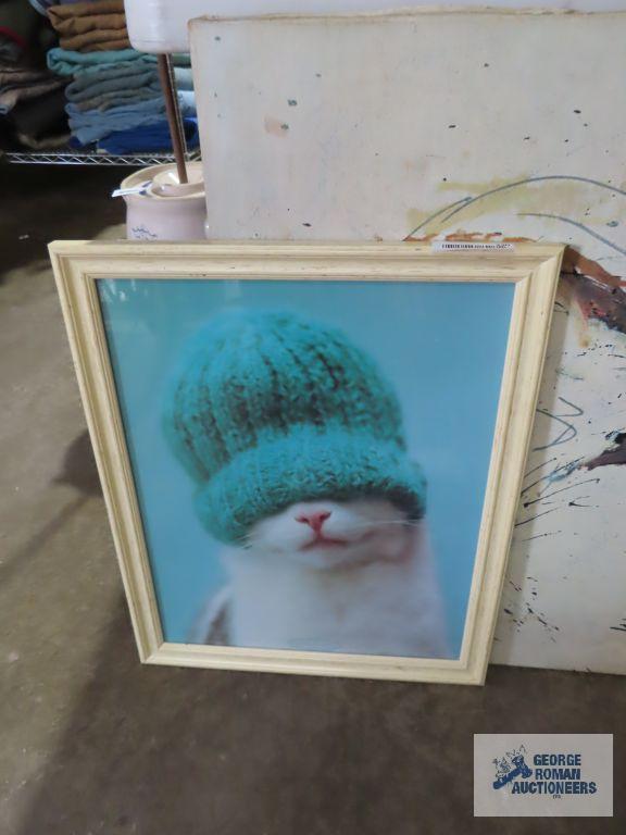 Variety of cat wall hangings and cat figurine