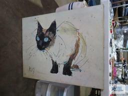 Variety of cat wall hangings and cat figurine