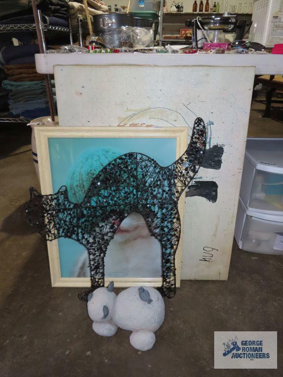 Variety of cat wall hangings and cat figurine