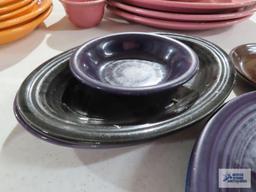 Assorted Fiesta dishware, cranberry, purple, and black
