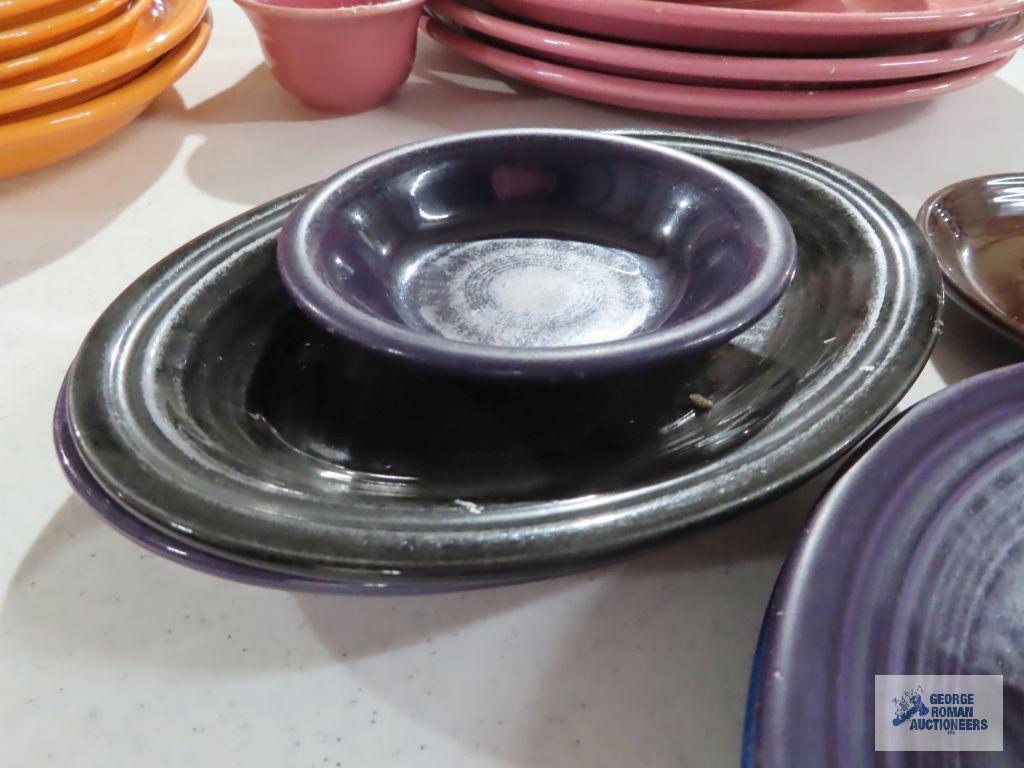 Assorted Fiesta dishware, cranberry, purple, and black