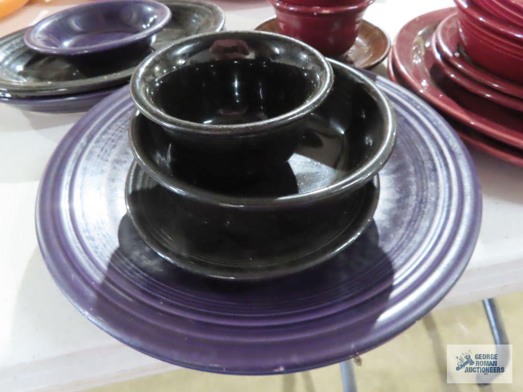 Assorted Fiesta dishware, cranberry, purple, and black