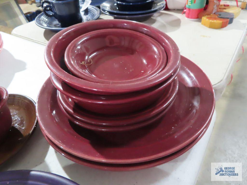 Assorted Fiesta dishware, cranberry, purple, and black
