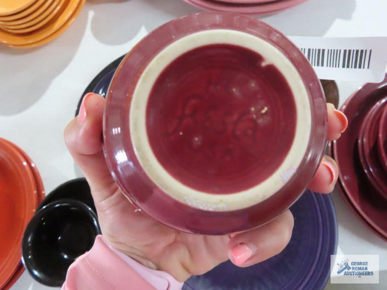 Assorted Fiesta dishware, cranberry, purple, and black