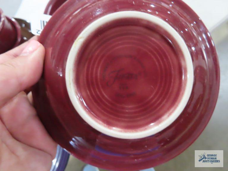 Assorted Fiesta dishware, cranberry, purple, and black