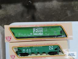 Three IHC ho gauge box cars new in boxes. one Ertl collectibles box car new in box.