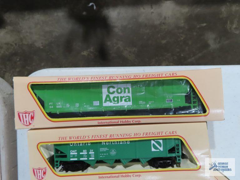 Three IHC ho gauge box cars new in boxes. one Ertl collectibles box car new in box.