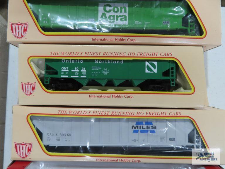 Three IHC ho gauge box cars new in boxes. one Ertl collectibles box car new in box.