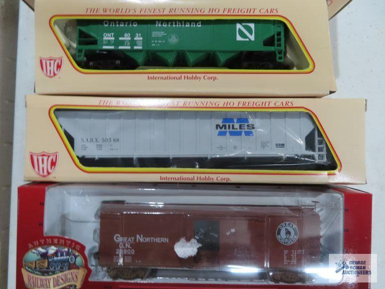 Three IHC ho gauge box cars new in boxes. one Ertl collectibles box car new in box.
