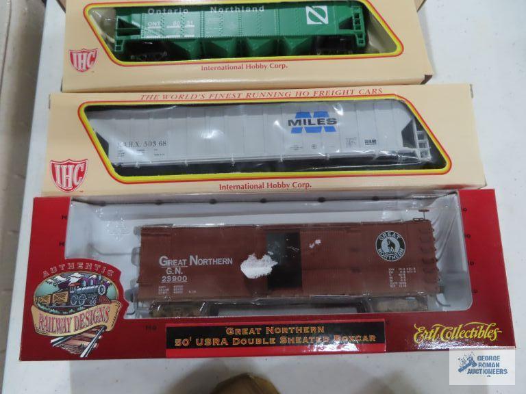 Three IHC ho gauge box cars new in boxes. one Ertl collectibles box car new in box.
