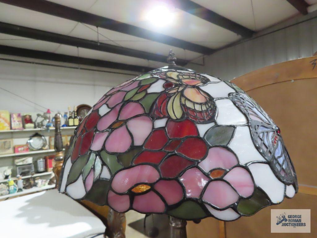 Metal floral based lamp with plastic tiffany style shade