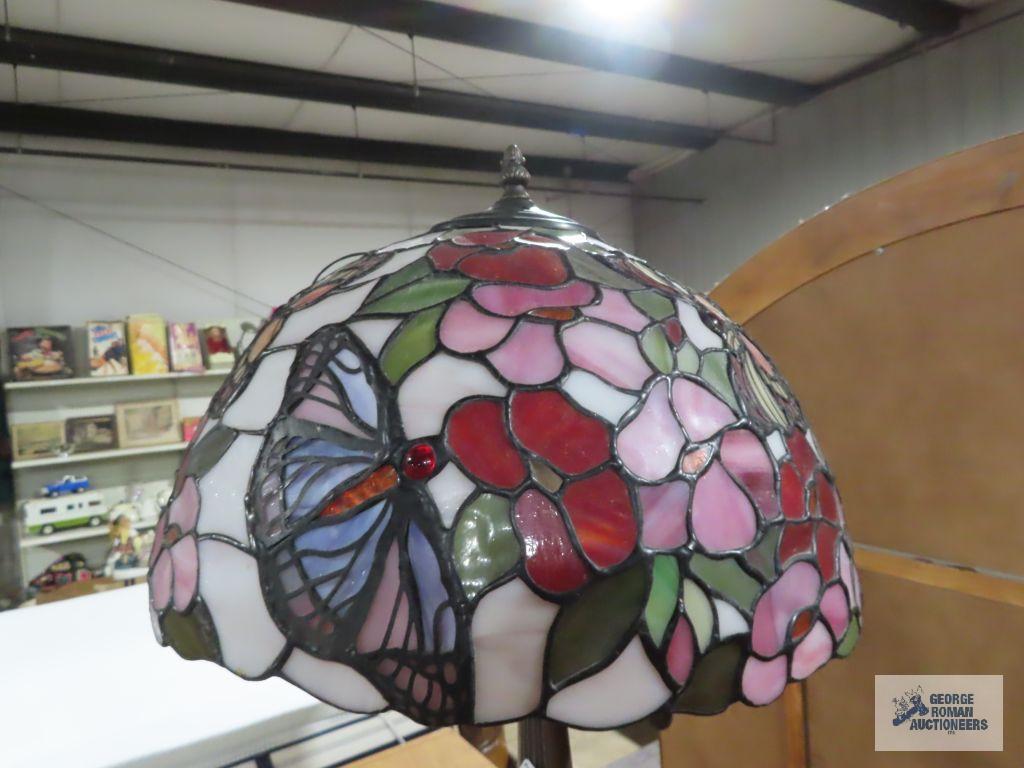 Metal floral based lamp with plastic tiffany style shade