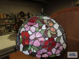 Metal floral based lamp with plastic tiffany style shade