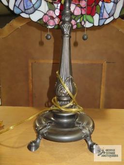 Metal floral based lamp with plastic tiffany style shade