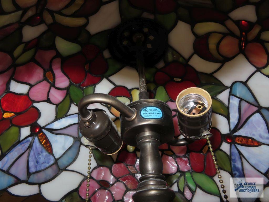 Metal floral based lamp with plastic tiffany style shade