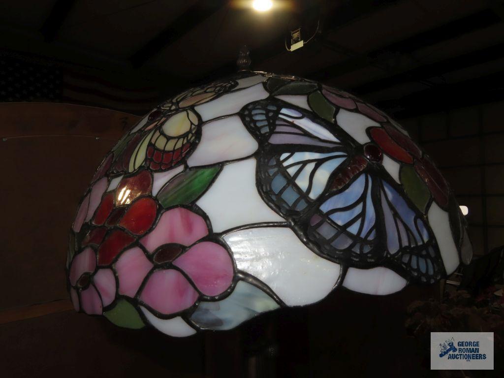 Metal floral based lamp with plastic tiffany style shade